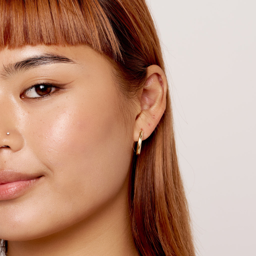 9 Carat Gold Twist Oval Hoop Earrings
